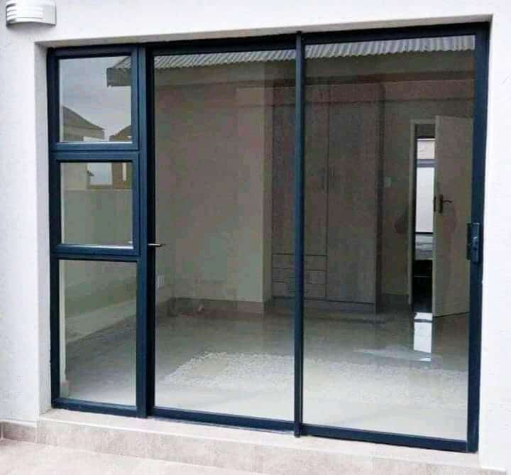 Aluminium sliding patio doors with side panel installed at a home
